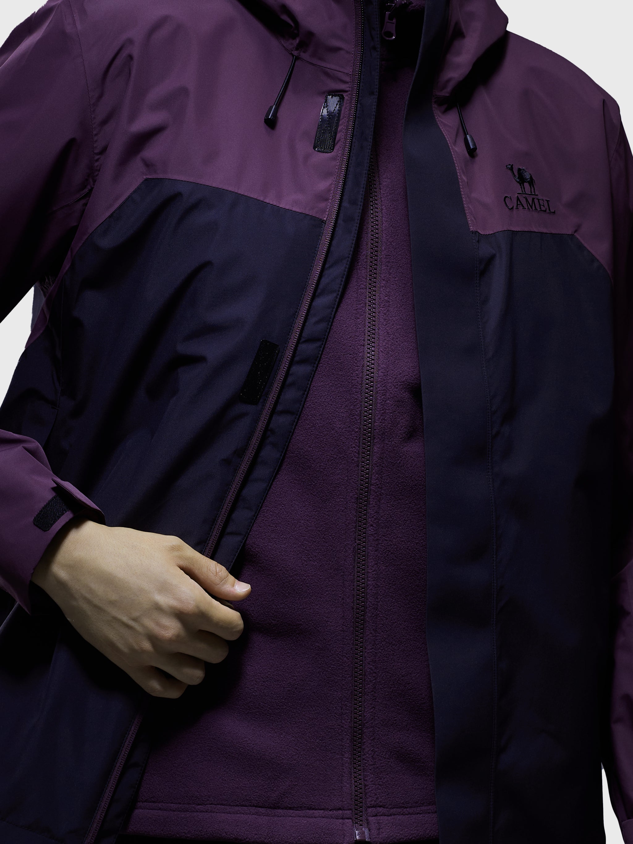 The shell of Camel Men’s Arctic Sentinel Elite Toray Dermizax® 3-in-1 Jacket windproof coat with far-infrared fleece