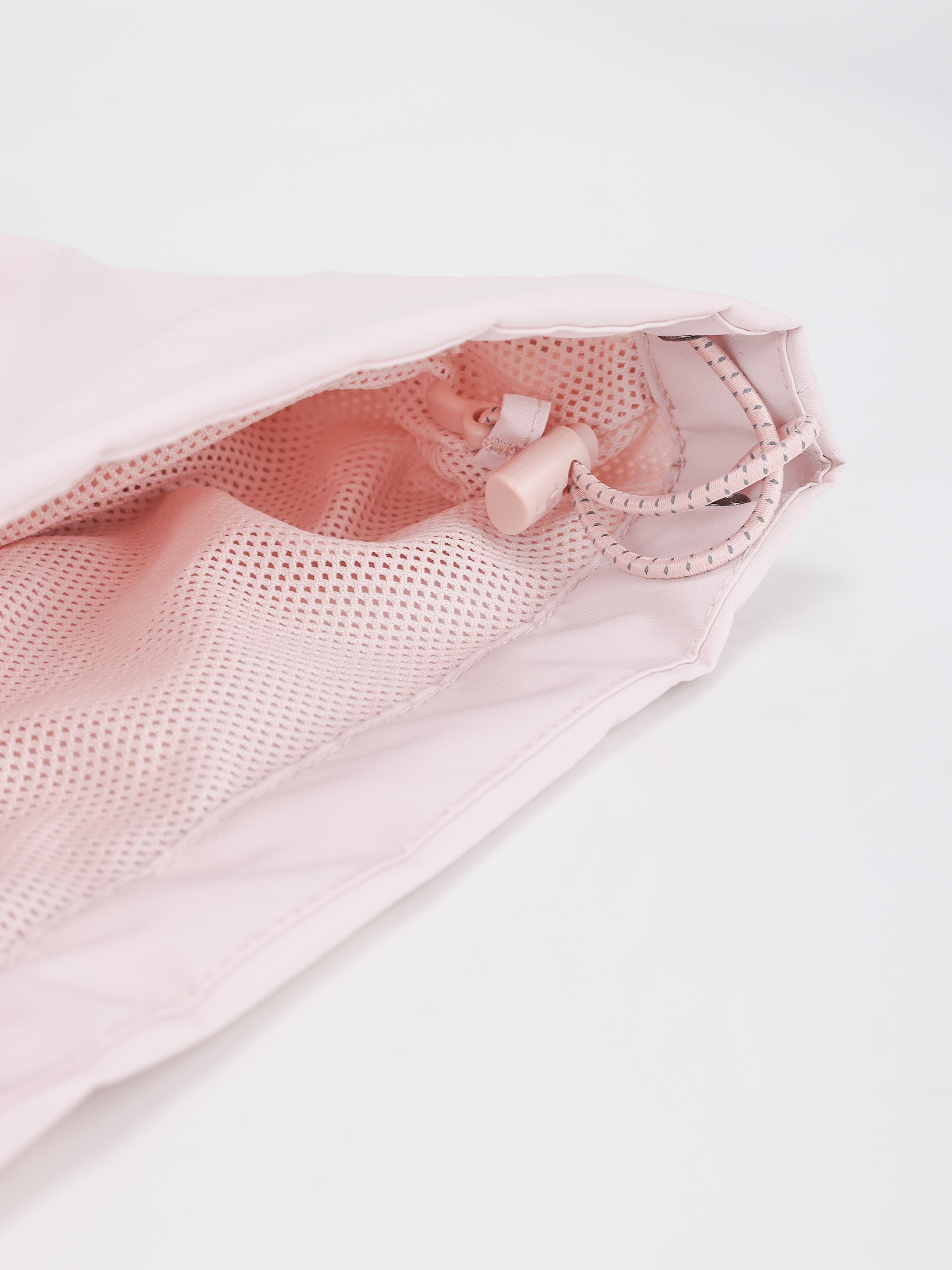 Hem of Camel Women’s Interstellar Traverse TOPEAK-TEX® Shell Jacket designed for trail, urban use with adjustable fit