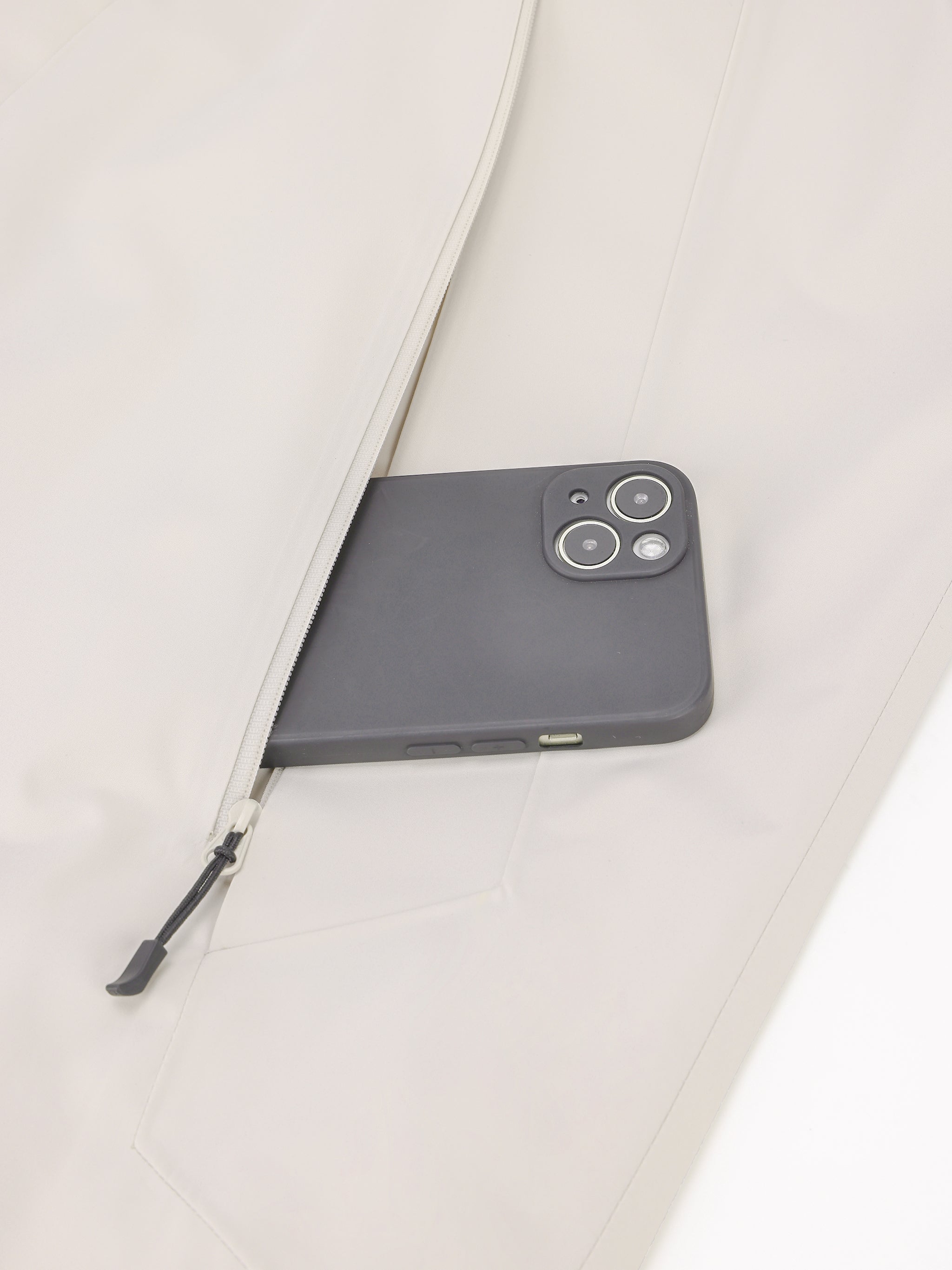 Pocket of Camel Men’s Interstellar Traverse TOPEAK-TEX® Shell Jacket designed for trail and urban use with adjustable fit